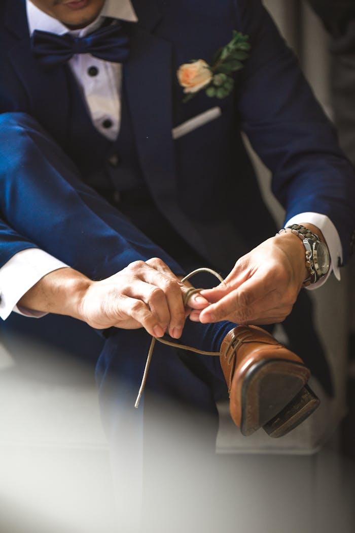 Person Tying Shoelaces